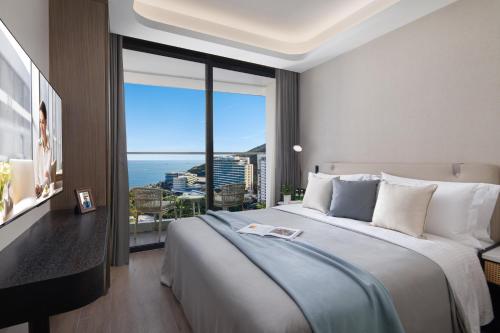 Imagen de la habitación del Hotel Ascott Dadonghai Bay Sanya. Foto 19