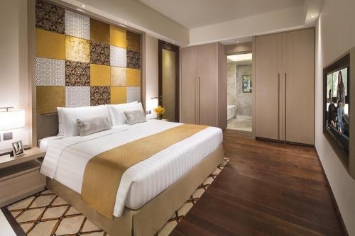 Imagen de la habitación del Hotel Ascott Macau. Foto 9