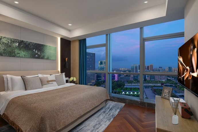 Imagen de la habitación del Hotel Ascott New District Wuxi. Foto 19