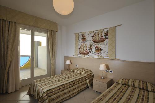 Imagen de la habitación del Hotel Ashanti Aparthotel Wellness&Spa. Foto 11