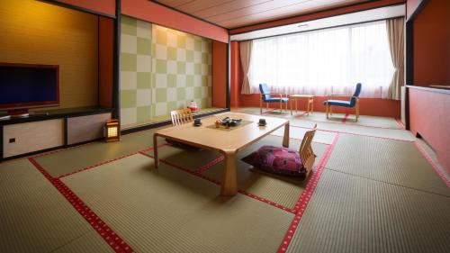 Imagen de la habitación del Hotel Ashinomaki Grand Hotel. Foto 16
