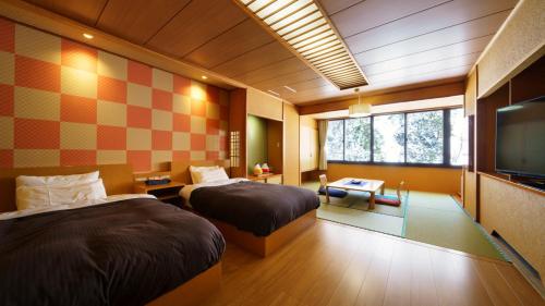 Imagen de la habitación del Hotel Ashinomaki Grand Hotel. Foto 17