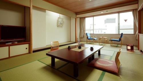 Imagen de la habitación del Hotel Ashinomaki Grand Hotel. Foto 18