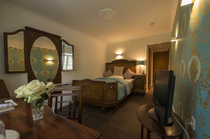 Imagen de la habitación del Hotel Ashley\'s Garden. Foto 5