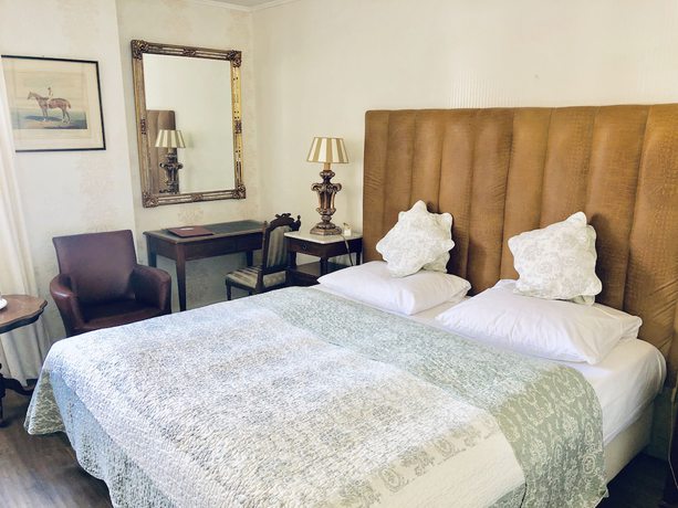 Imagen de la habitación del Hotel Ashley\'s Garden. Foto 13