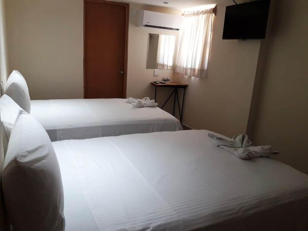Imagen de la habitación del Hotel Ashly Loma Larga. Foto 7