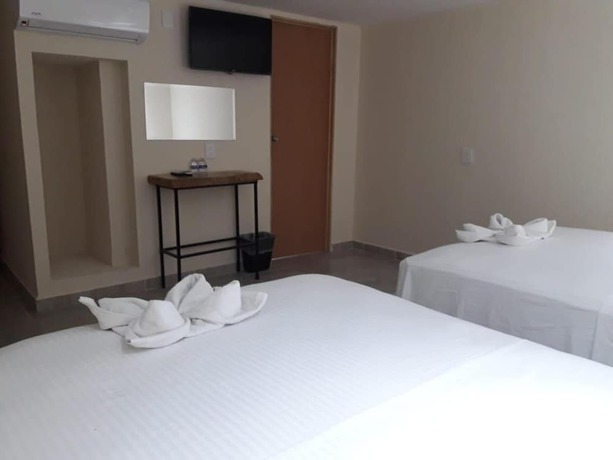 Imagen de la habitación del Hotel Ashly Loma Larga. Foto 12