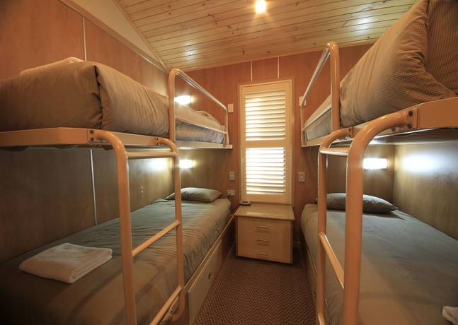 Imagen de la habitación del Hotel Ashmore Palms Holiday Village. Foto 12