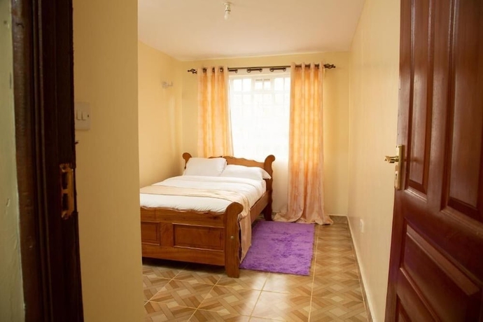 Imagen de la habitación del Hotel Ashville Homes. Foto 7
