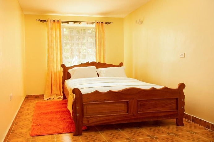 Imagen de la habitación del Hotel Ashville Homes. Foto 8