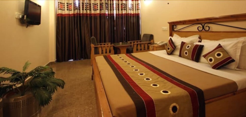 Imagen de la habitación del Hotel Asian Plaza Mcleodganj. Foto 11
