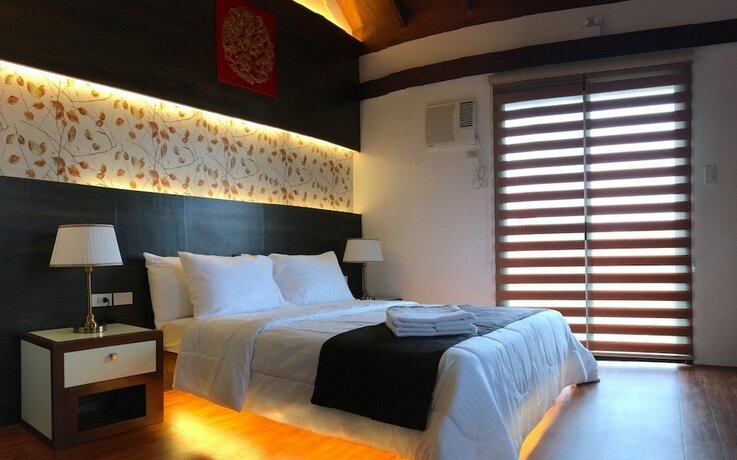 Imagen de la habitación del Hotel Asian Village Tagaytay. Foto 26