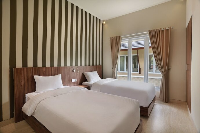 Imagen de la habitación del Hotel Askara Canggu Townhouse. Foto 18