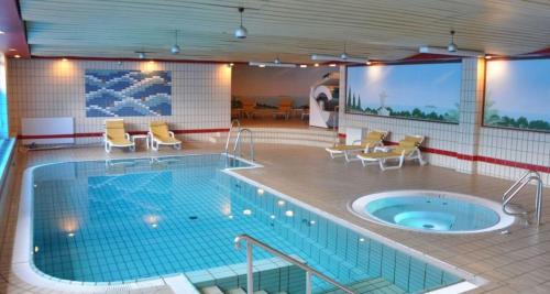 Imagen de la piscina del Hotel Aspire Oldenburg, Trademark Collection by Wyndham. Foto 5