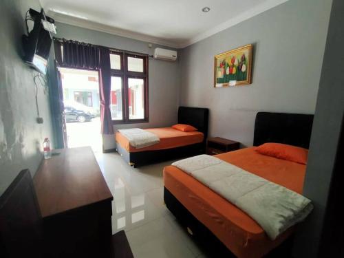Imagen de la habitación del Hotel Asri Baru. Foto 18