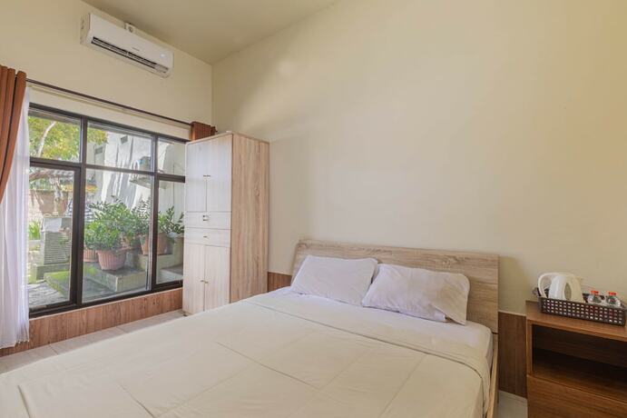 Imagen de la habitación del Hotel Asri Guesthouse. Foto 15