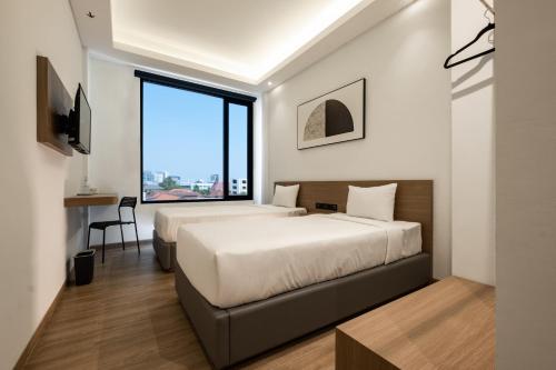 Imagen de la habitación del Hotel Assa. Foto 14