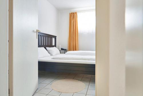 Imagen de la habitación del Hotel Asslar. Foto 6