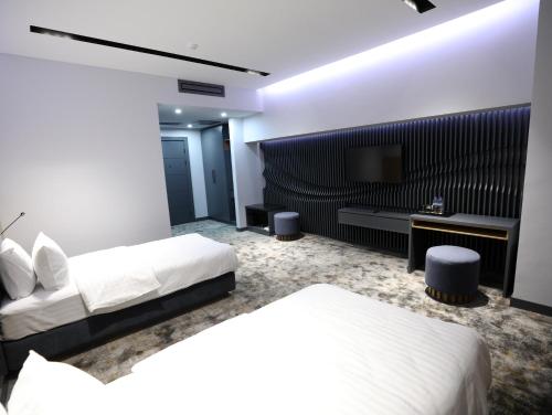 Imagen de la habitación del Hotel Astra hotel. Foto 18