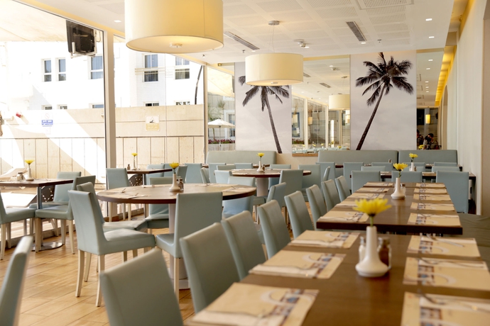 Imagen del bar/restaurante del Hotel Astral Nirvana Suites. Foto 2