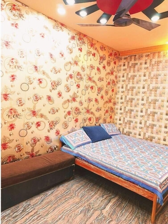 Imagen de la habitación del Hotel Atharv Paying Guest House. Foto 9