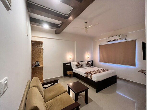 Imagen de la habitación del Hotel Athasri HSR Layout. Foto 18