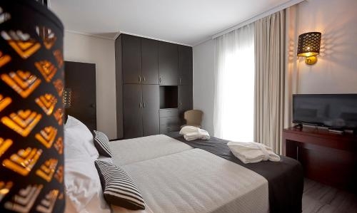 Imagen de la habitación del Hotel Athenian Riviera and Suites. Foto 9