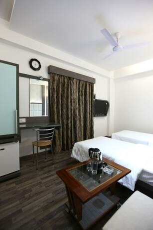 Imagen de la habitación del Hotel Atithi The. Foto 18