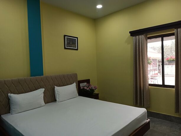 Imagen de la habitación del Hotel Atithya Resort. Foto 13