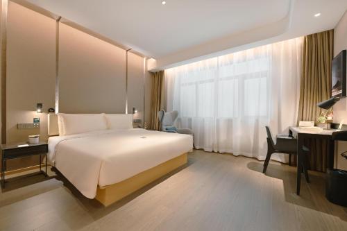 Imagen de la habitación del Hotel Atour Beijing Guomao Panjia Yuan. Foto 7