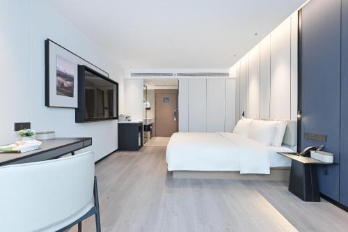 Imagen de la habitación del Hotel Atour Beijing Hepingli UIBE. Foto 3
