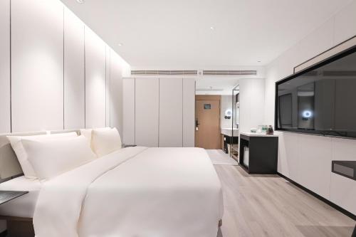 Imagen de la habitación del Hotel Atour Beijing Hepingli UIBE. Foto 5