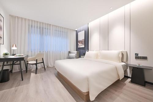 Imagen de la habitación del Hotel Atour Beijing Hepingli UIBE. Foto 8