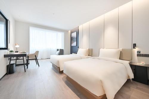 Imagen de la habitación del Hotel Atour Beijing Hepingli UIBE. Foto 10