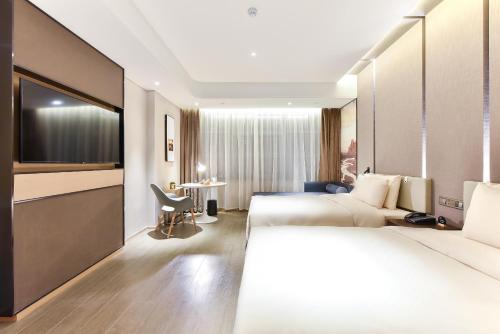 Imagen de la habitación del Hotel Atour Beijing Linkong New International Exhibition Center. Foto 17