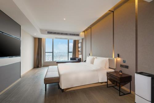 Imagen de la habitación del Hotel Atour Dongguan Fenggang. Foto 12