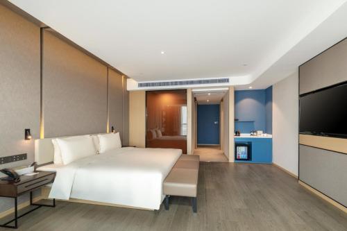 Imagen de la habitación del Hotel Atour Dongguan Fenggang. Foto 13