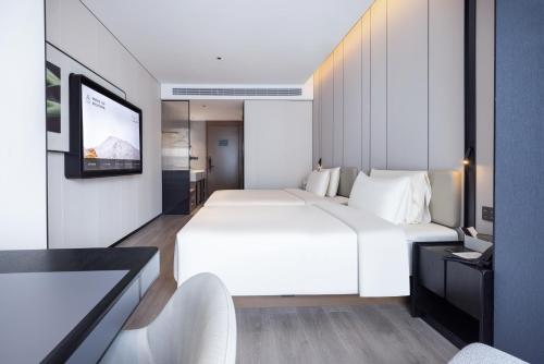 Imagen general del Hotel Atour Emeishan Railway Station Exiu Lake. Foto 6