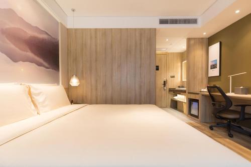 Imagen de la habitación del Hotel Atour Guangzhou Huadu Square. Foto 13