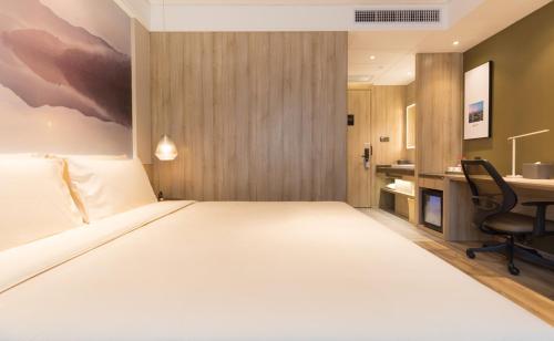 Imagen de la habitación del Hotel Atour Guangzhou Huadu Square. Foto 19