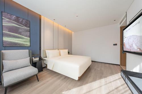 Imagen de la habitación del Hotel Atour Guangzhou Pazhou Convention and Exhibition Center Information Port. Foto 14