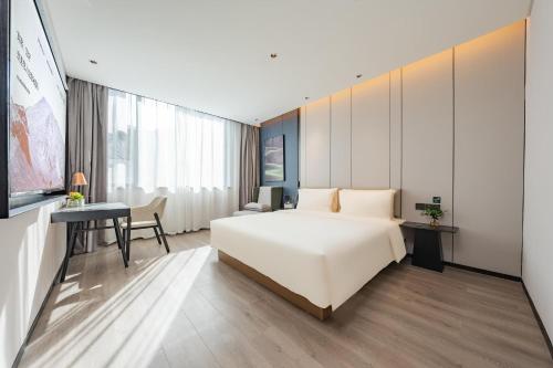 Imagen de la habitación del Hotel Atour Guangzhou Pazhou Convention and Exhibition Center Information Port. Foto 16