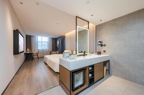 Imagen de la habitación del Hotel Atour Guangzhou Pazhou Convention and Exhibition Center Information Port. Foto 17