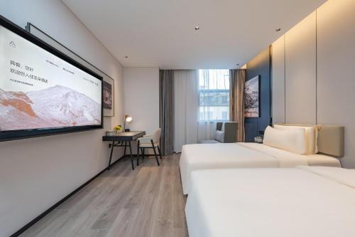 Imagen de la habitación del Hotel Atour Guangzhou Pazhou Convention and Exhibition Center Information Port. Foto 18