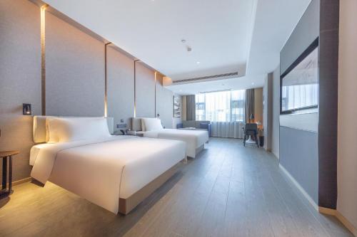 Imagen de la habitación del Hotel Atour Haikou East High-Speed Railway Station Xueyuan Road. Foto 12