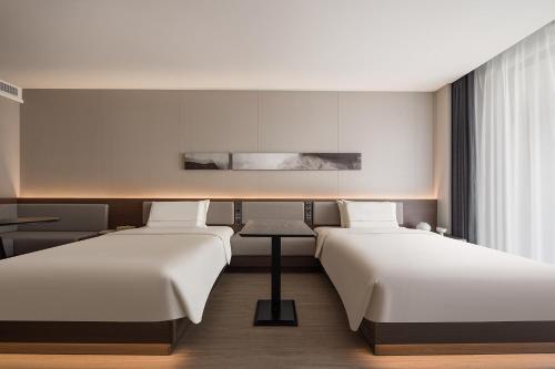 Imagen de la habitación del Hotel Atour Haikou Longhua Jinniuling Park. Foto 10