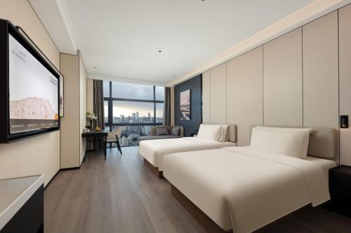 Imagen de la habitación del Hotel Atour Haikou Wanguo Metropolis Qilou Old Street. Foto 11