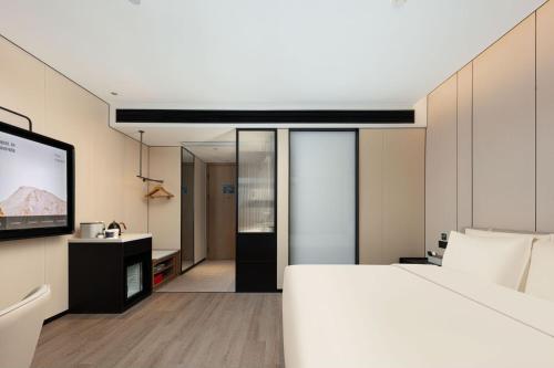 Imagen de la habitación del Hotel Atour Haikou Wanguo Metropolis Qilou Old Street. Foto 14