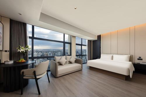 Imagen de la habitación del Hotel Atour Haikou Wanguo Metropolis Qilou Old Street. Foto 15