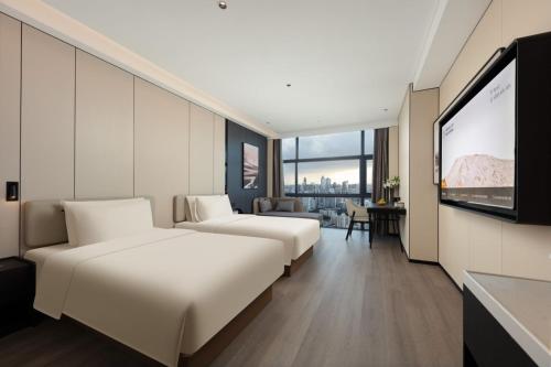 Imagen de la habitación del Hotel Atour Haikou Wanguo Metropolis Qilou Old Street. Foto 16